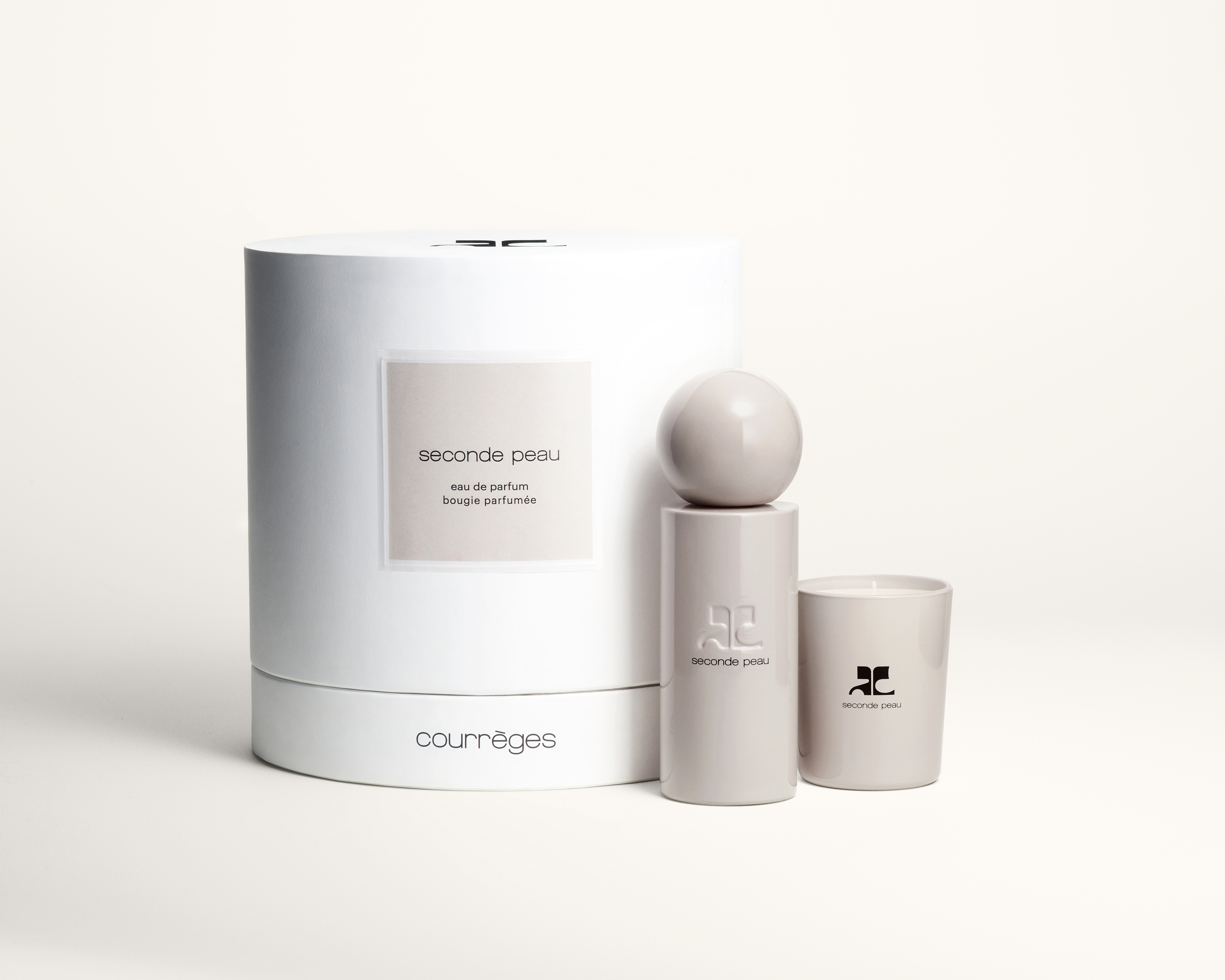 Courrèges Seconde Peau Set = E.d.P. Nat. Spray 100 ml + Duftkerze 75 g